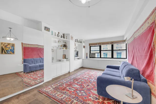 a living room with furniture and a rug