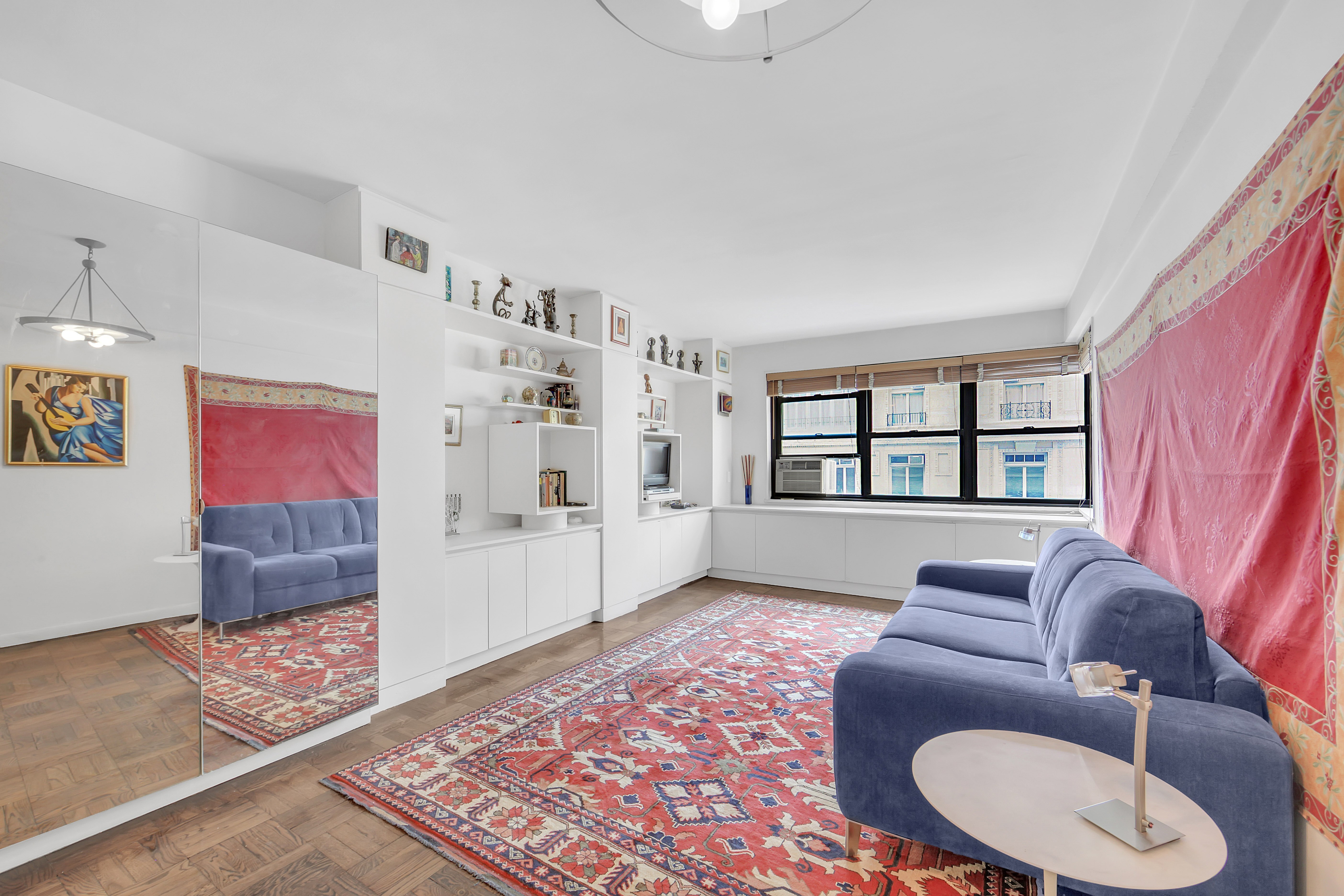 Undisclosed Address Manhattan, NY 10128 - Photo 5 of 9 a living room with furniture and a rug