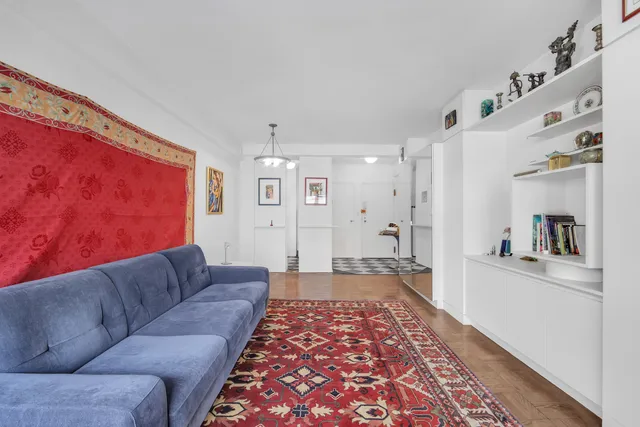 a living room with furniture and a rug