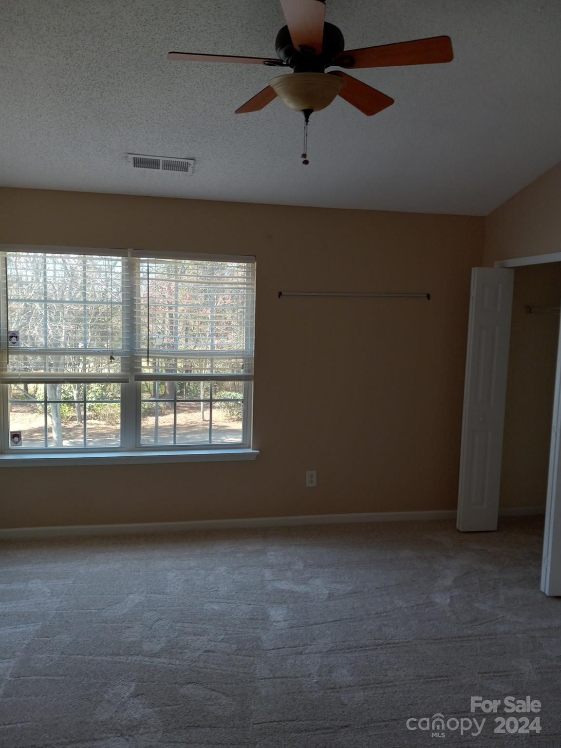 11015 Kinston Ridge Place Charlotte, NC 28273 - Photo 7 of 10 an empty room with a window