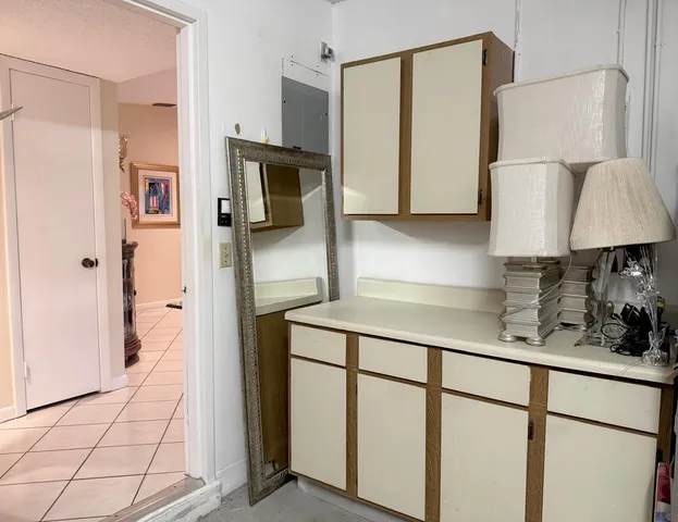 a kitchen with stainless steel appliances a refrigerator and cabinets