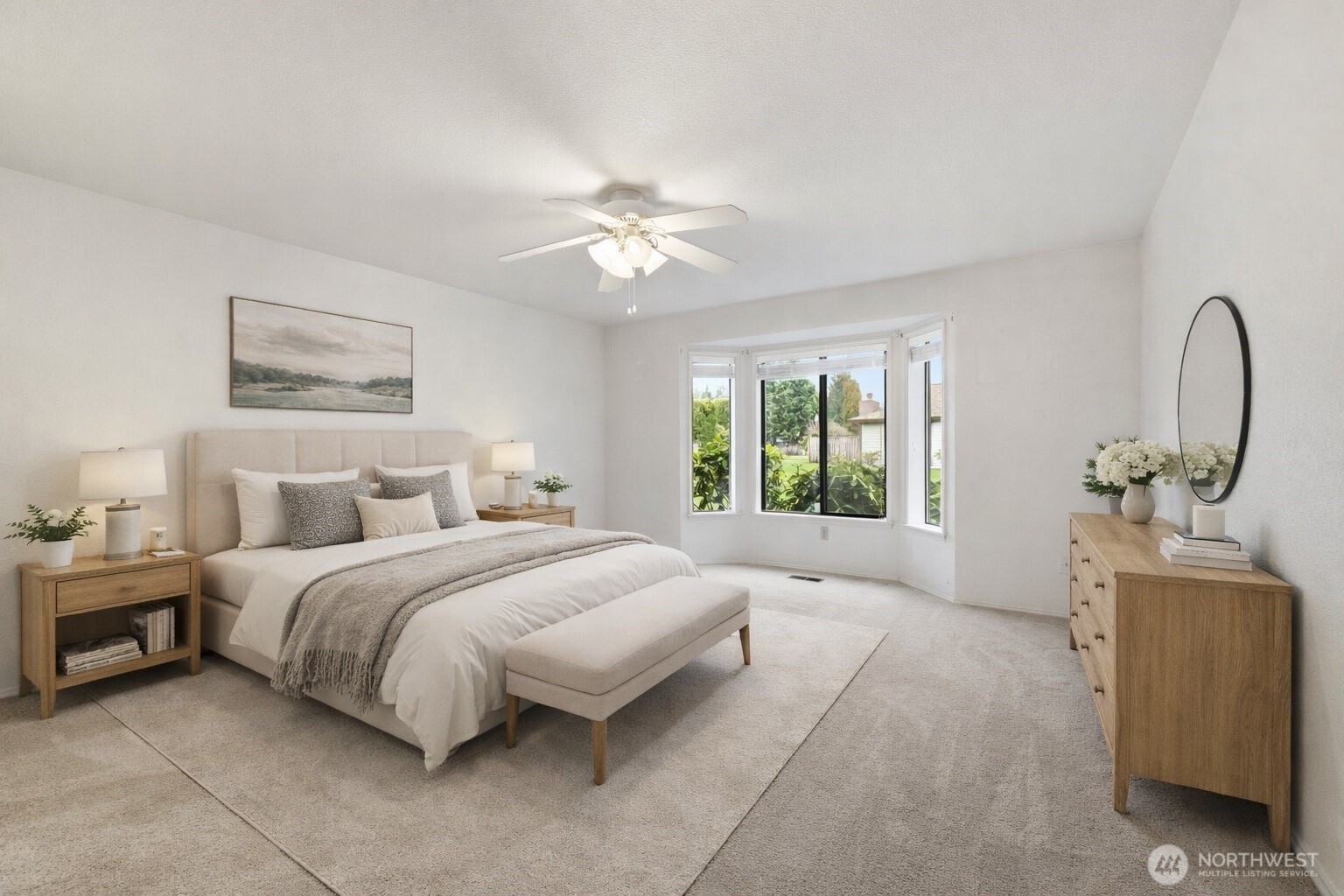 7904 53rd Street West University Place, WA 98467 - Photo 14 of 29 a spacious bedroom with a bed and a chandelier