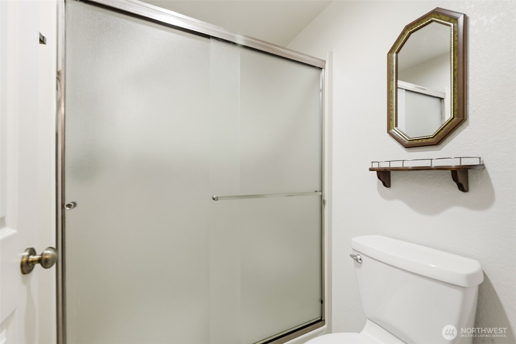 7904 53rd Street West University Place, WA 98467 - Photo 19 of 29 a bathroom with a granite countertop sink and a mirror