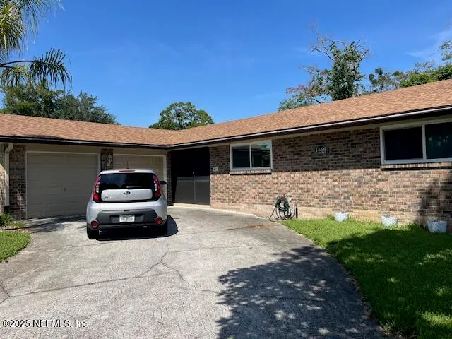 a car parked in front of a house