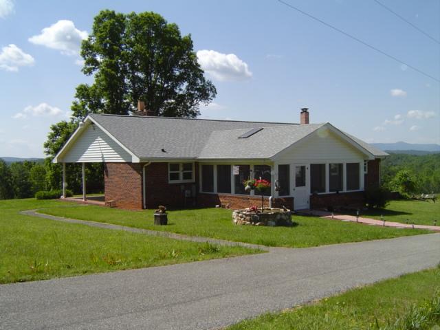 1370 Johnny's Ridge Road Ferrum, VA 24088 - Photo 1 of 24 a front view of a house with garden