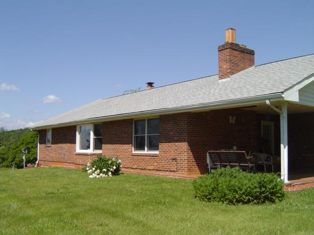 1370 Johnny's Ridge Road Ferrum, VA 24088 - Photo 14 of 24 a front view of a house with garden