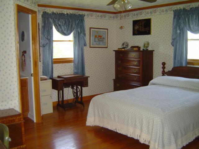 1370 Johnny's Ridge Road Ferrum, VA 24088 - Photo 8 of 24 a bedroom with a bed and a window