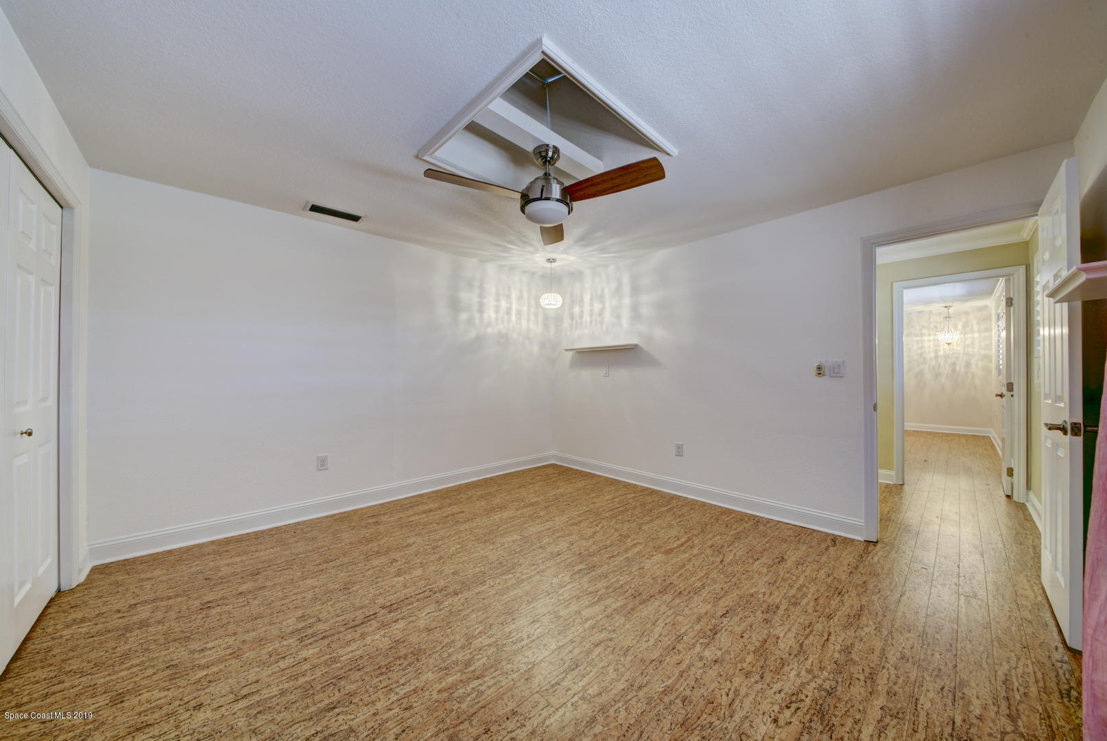 5725 Lake Washington Road Melbourne, FL 32934 - Photo 24 of 72 Bedroom 2 with Cork Floor