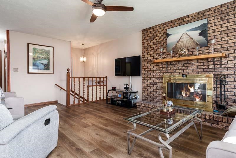 5280 Sunbird Drive Loves Park, IL 61111 - Photo 11 of 42 a living room with furniture and a fireplace
