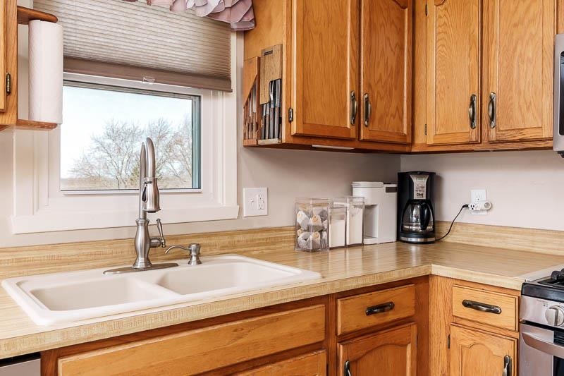 5280 Sunbird Drive Loves Park, IL 61111 - Photo 15 of 42 a kitchen with stainless steel appliances granite countertop a sink and a white cabinets