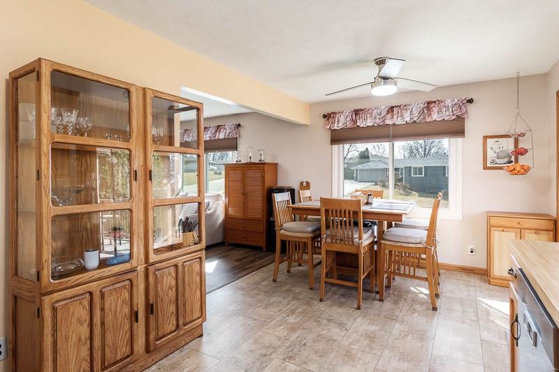 5280 Sunbird Drive Loves Park, IL 61111 - Photo 16 of 42 a view of a dining room with furniture large window and wooden floor