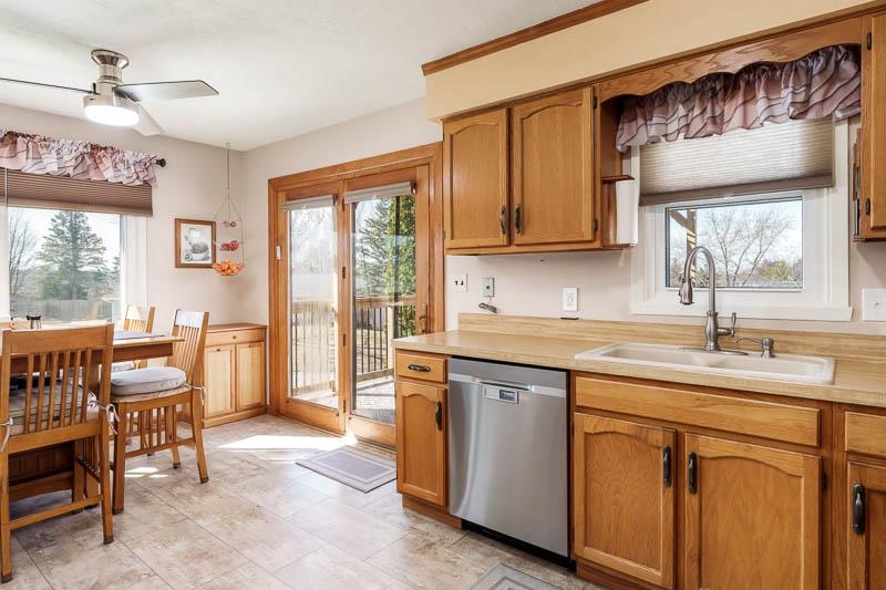 5280 Sunbird Drive Loves Park, IL 61111 - Photo 17 of 42 a kitchen that has a sink and a table in it