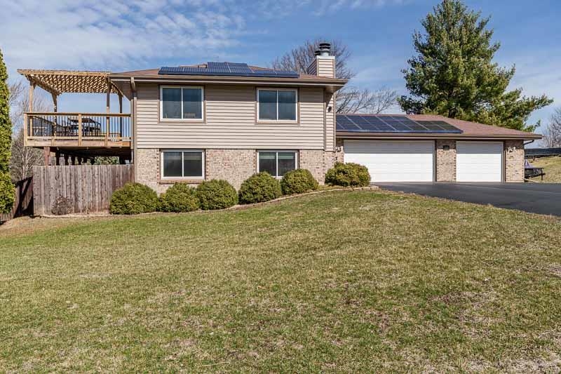 5280 Sunbird Drive Loves Park, IL 61111 - Photo 2 of 42 front view of a house with a yard