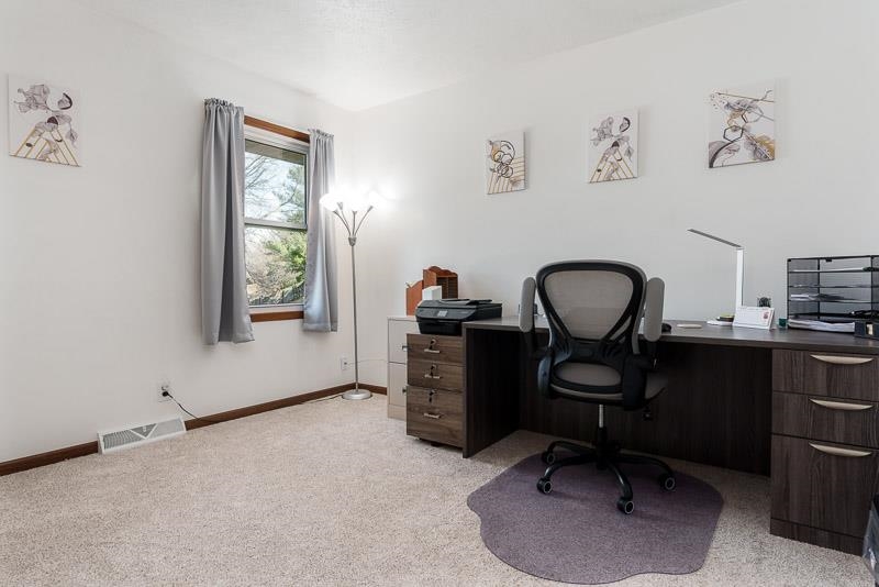 5280 Sunbird Drive Loves Park, IL 61111 - Photo 21 of 42 a view of a workspace with furniture and a window