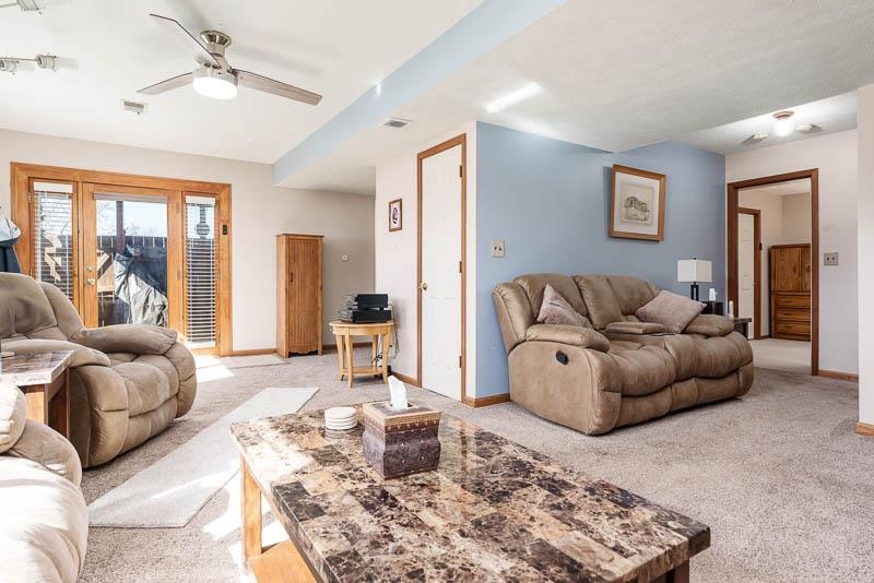 5280 Sunbird Drive Loves Park, IL 61111 - Photo 25 of 42 a living room with furniture and a rug