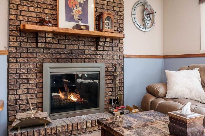 5280 Sunbird Drive Loves Park, IL 61111 - Photo 26 of 42 a living room with furniture a clock and wall