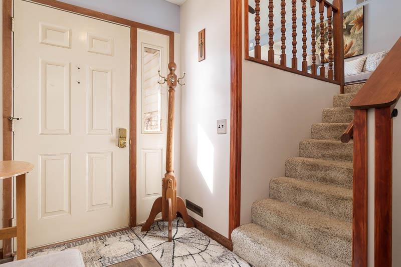 5280 Sunbird Drive Loves Park, IL 61111 - Photo 4 of 42 a view of a hallway with windows and entryway