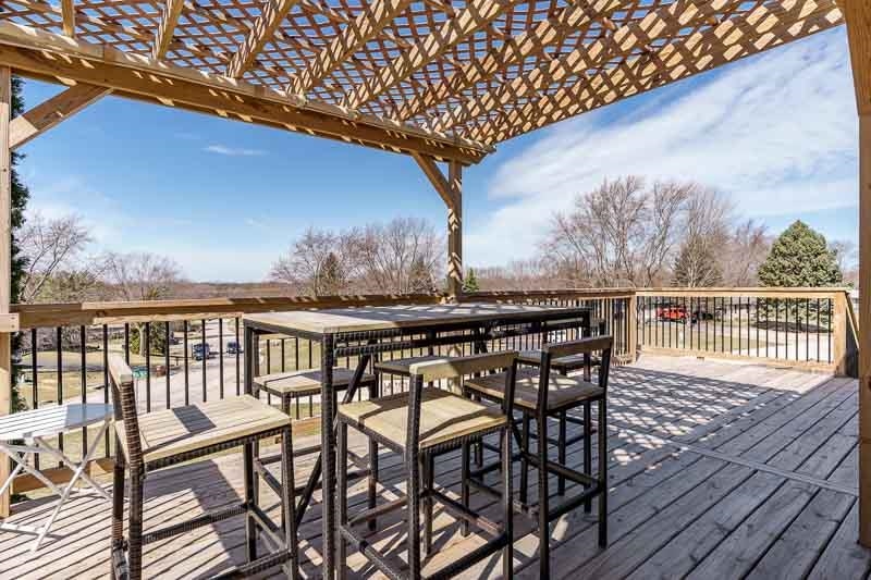 5280 Sunbird Drive Loves Park, IL 61111 - Photo 42 of 42 a view of a chairs and table on the wooden roof deck
