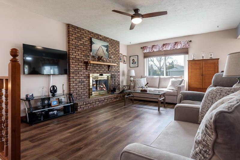 5280 Sunbird Drive Loves Park, IL 61111 - Photo 6 of 42 a living room with furniture and a flat screen tv