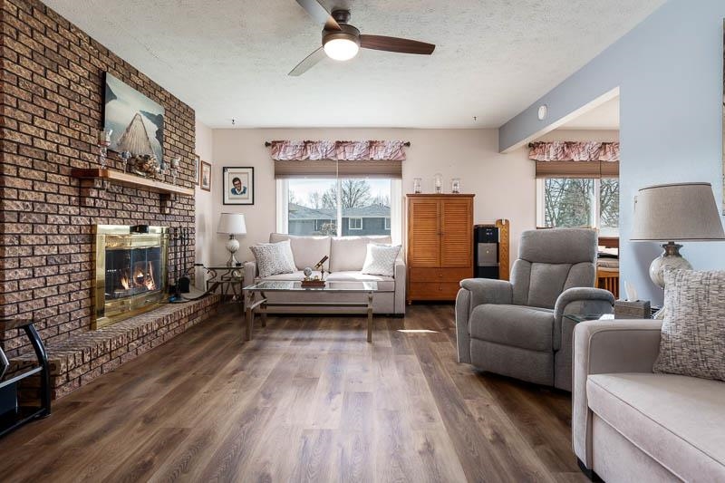 5280 Sunbird Drive Loves Park, IL 61111 - Photo 7 of 42 a living room with furniture and a fireplace