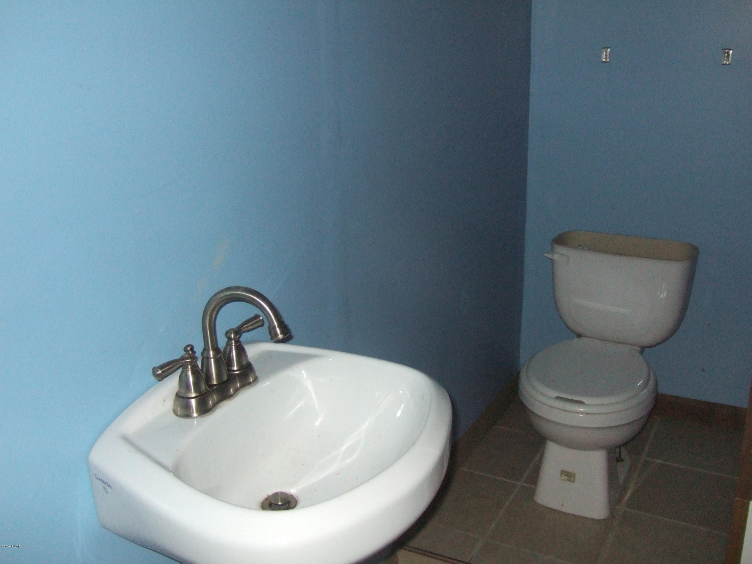 2654 Boulder Road Lake Ariel, PA 18436 - Photo 33 of 40 a bathroom with a toilet and a sink