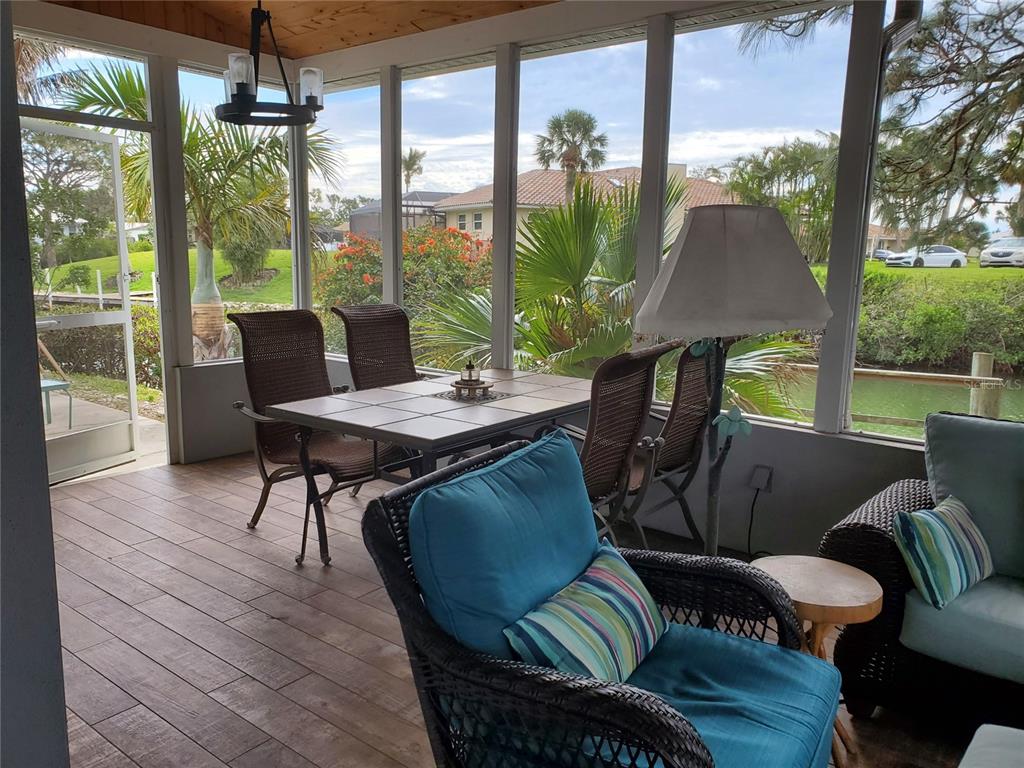 227 Lychee Road Nokomis, FL 34275 - Photo 12 of 36 a outdoor living space with furniture and garden view