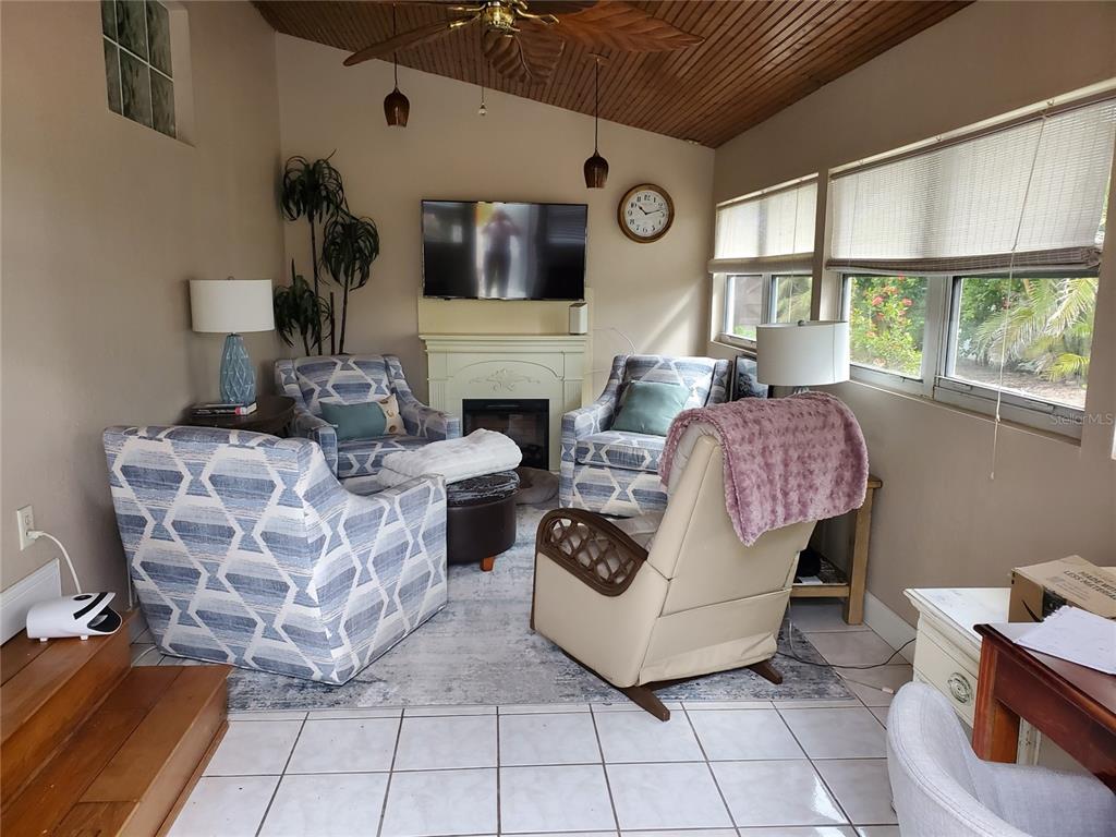 227 Lychee Road Nokomis, FL 34275 - Photo 13 of 36 a living room with furniture and a large window