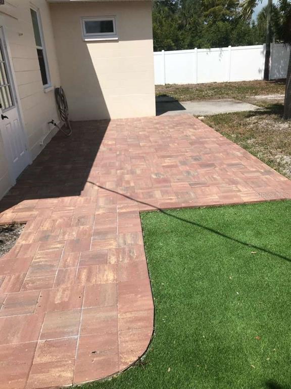 227 Lychee Road Nokomis, FL 34275 - Photo 14 of 36 a view of a backyard