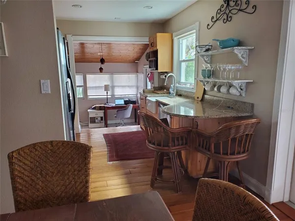 a view of kitchen and dining room with furniture