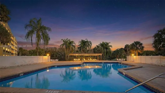 a view of swimming pool with outdoor seating