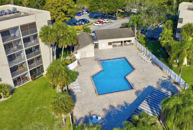a view of swimming pool with outdoor seating