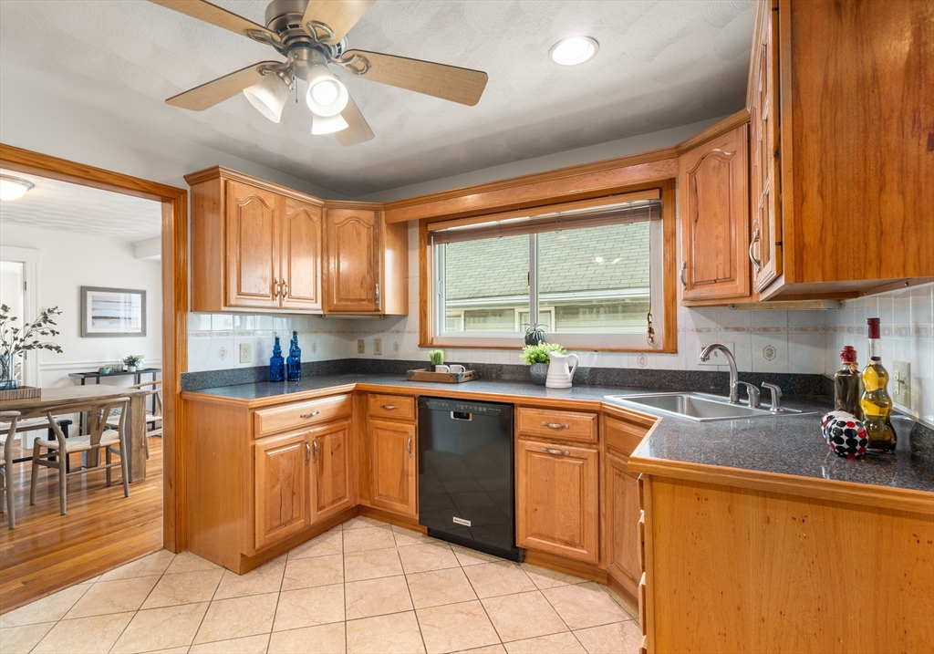 93 Puritan Road, Unit 93 Somerville, MA 02145 - Photo 8 of 20 a kitchen with a sink a counter top space cabinets and stainless steel appliances