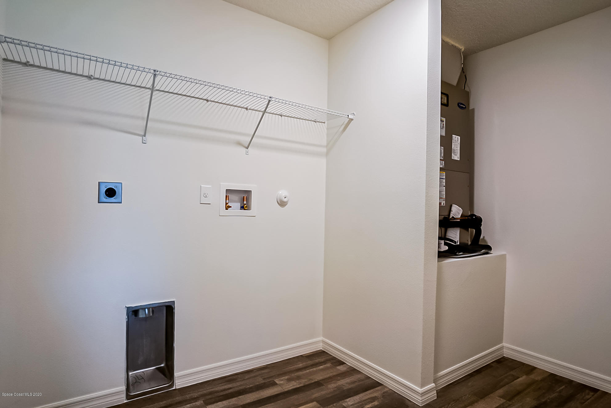 499 Scenic Road Palm Bay, FL 32908 - Photo 12 of 22 a view of storage and utility room with closet