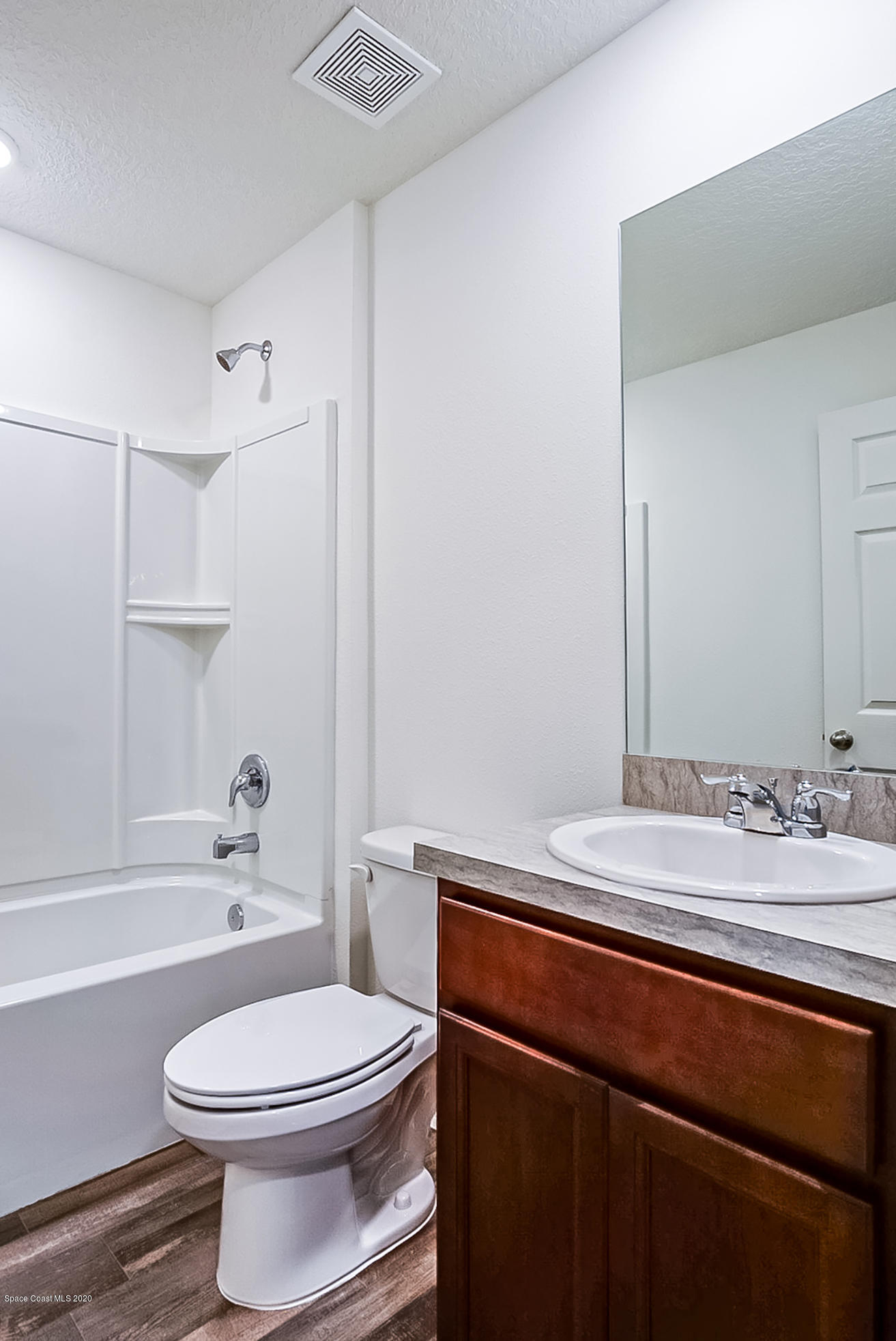 499 Scenic Road Palm Bay, FL 32908 - Photo 15 of 22 a bathroom with a sink a toilet and shower