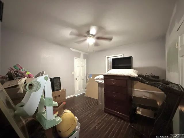 a view of a workspace with furniture and a flat screen tv