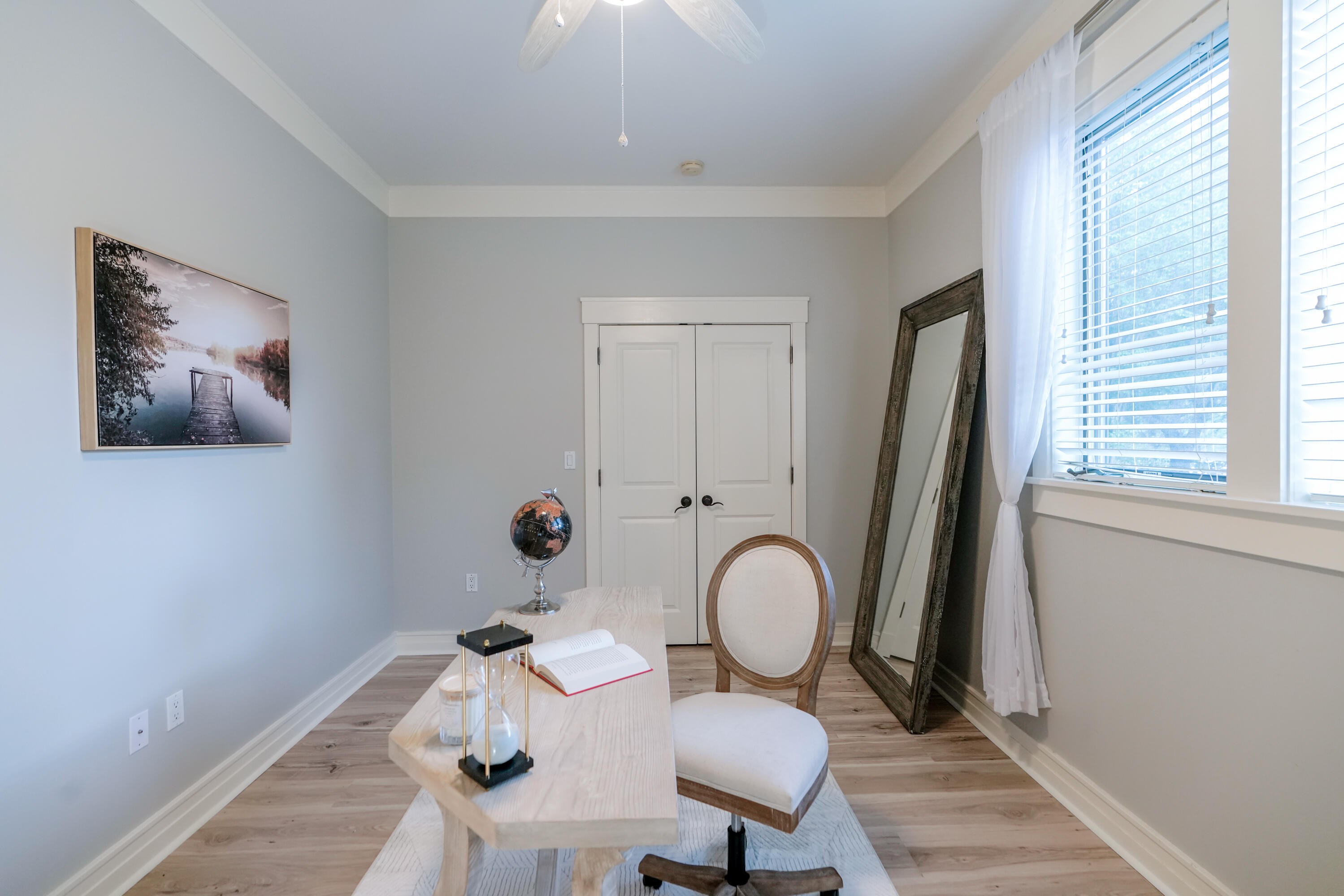 1101 Prospect Promenade, Unit 101 Panama City Beach, FL 32413 - Photo 22 of 49 a view of a dining room with furniture window and wooden floor