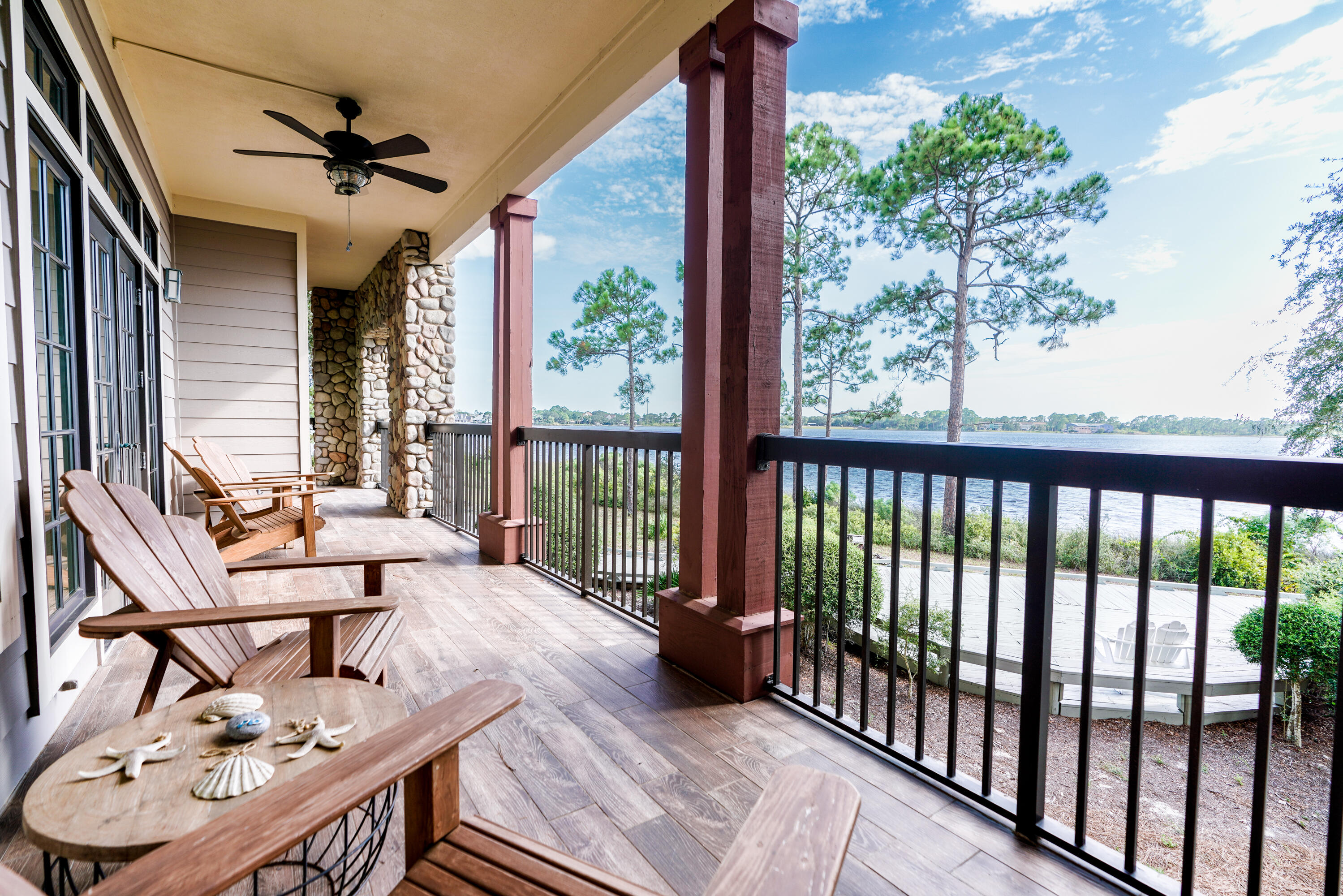 1101 Prospect Promenade, Unit 101 Panama City Beach, FL 32413 - Photo 24 of 49 a balcony with furniture and a potted plant