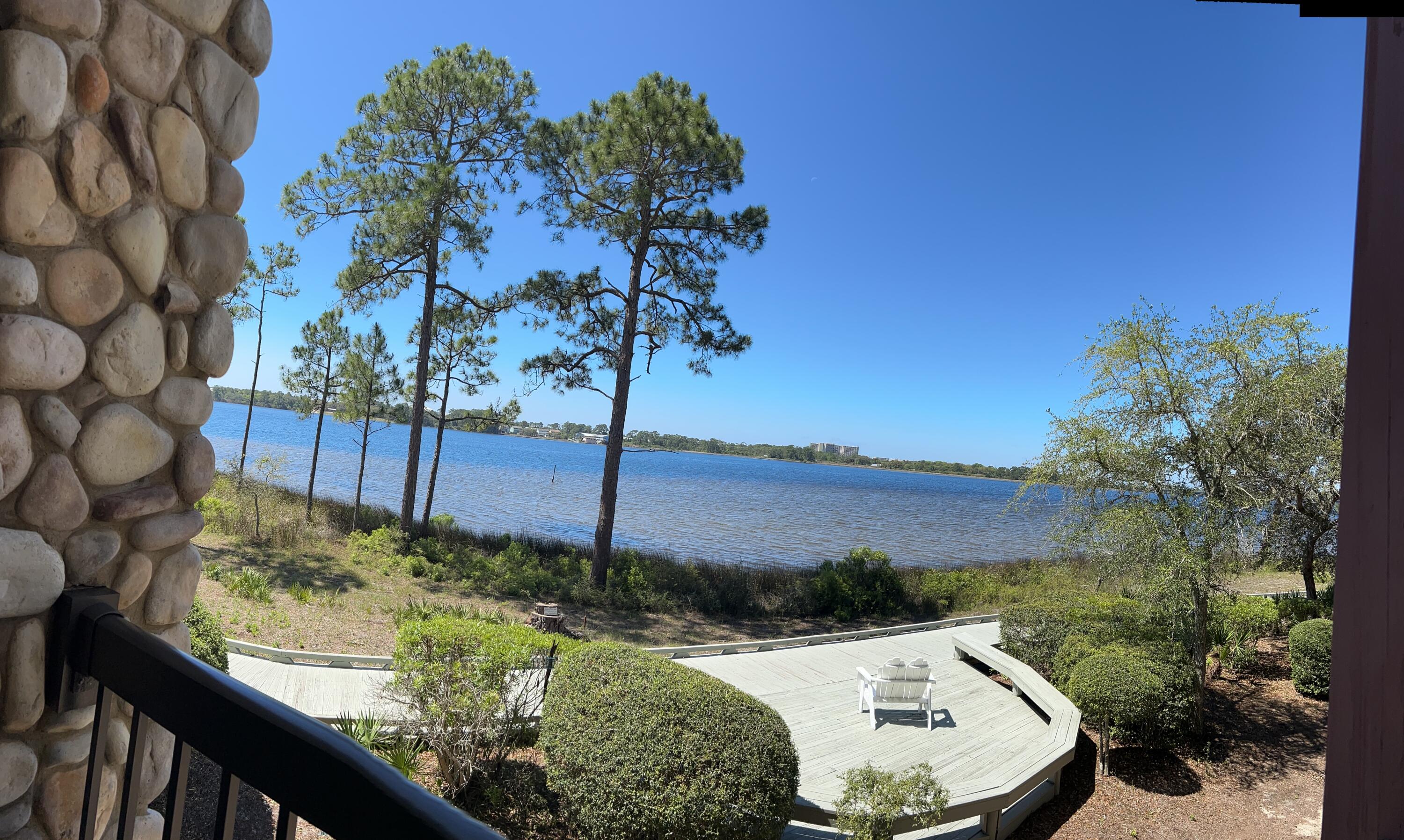 1101 Prospect Promenade, Unit 101 Panama City Beach, FL 32413 - Photo 38 of 49 a view of a backyard with a fountain