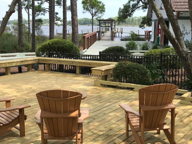 1101 Prospect Promenade, Unit 101 Panama City Beach, FL 32413 - Photo 39 of 49 a view of swimming pool with outdoor seating and plants