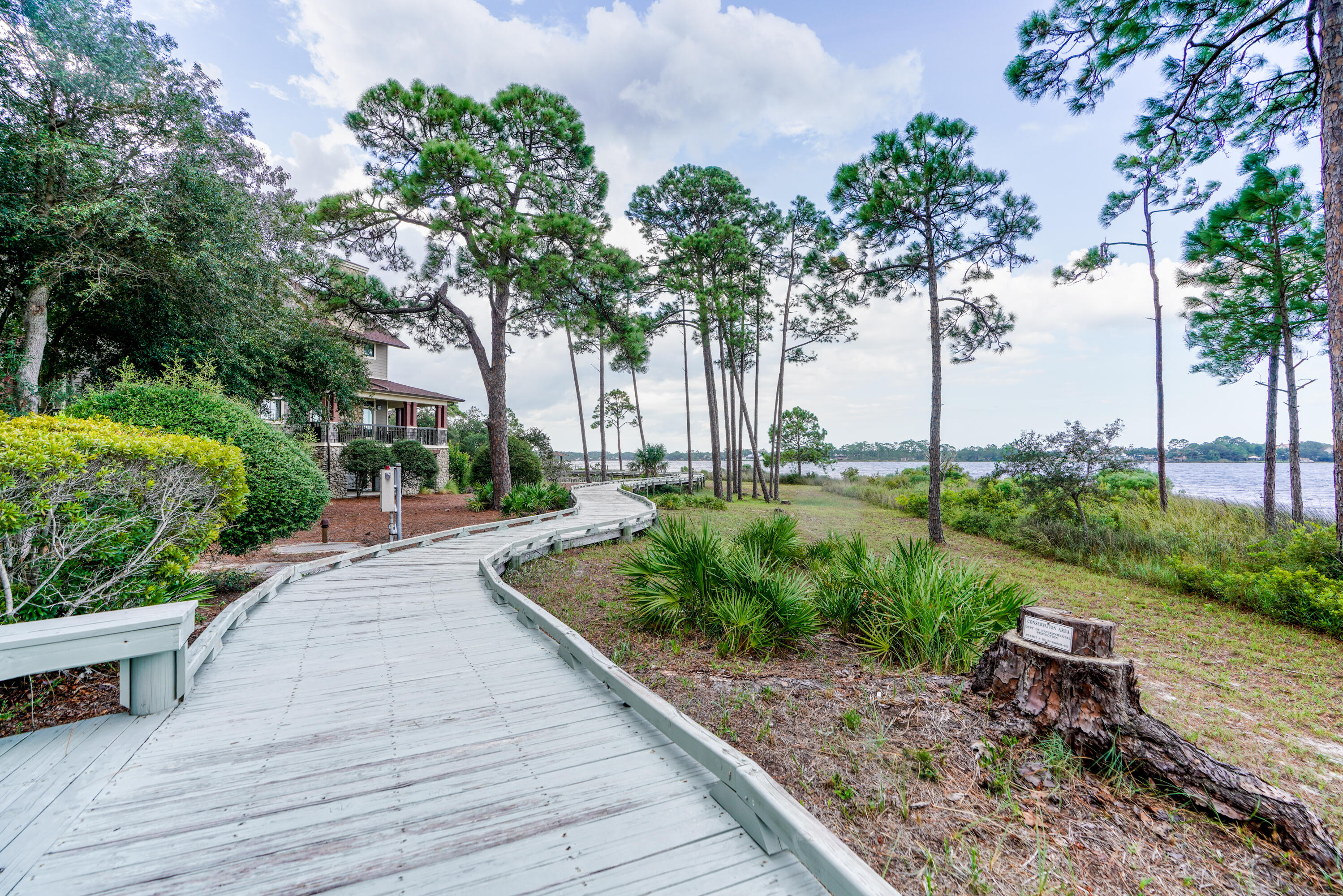 1101 Prospect Promenade, Unit 101 Panama City Beach, FL 32413 - Photo 43 of 49 a view of a backyard with sitting area
