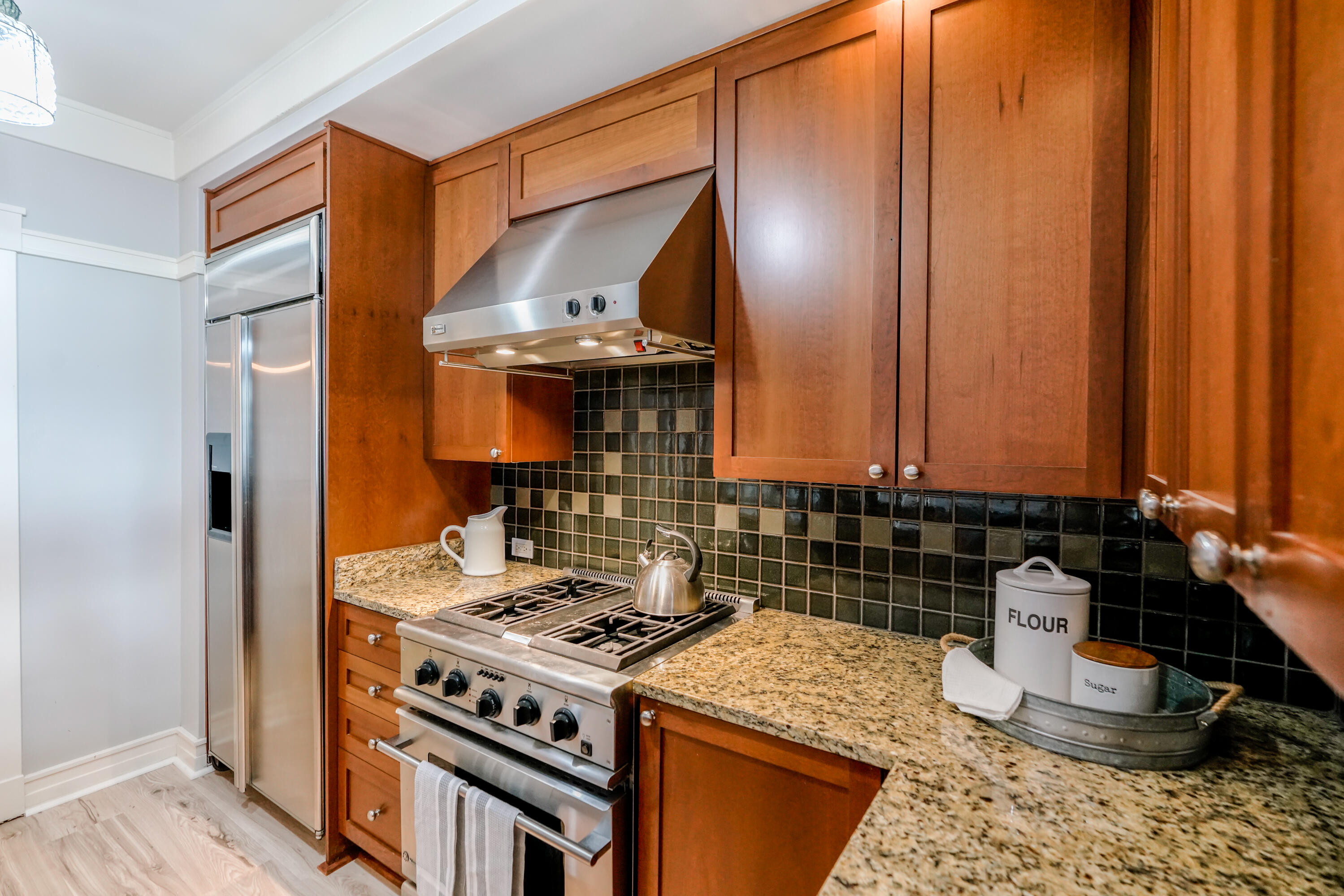 1101 Prospect Promenade, Unit 101 Panama City Beach, FL 32413 - Photo 10 of 49 a kitchen with a stove and a sink