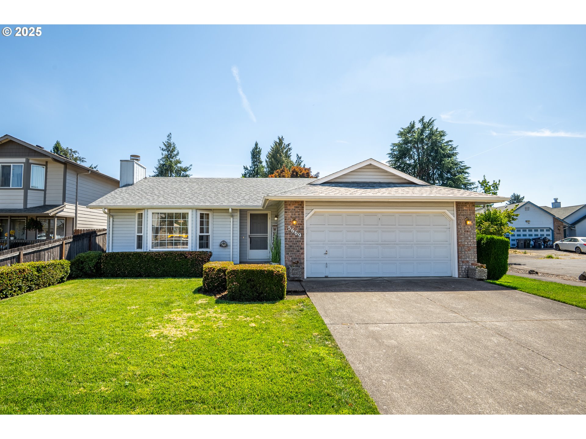 5669 D Street Springfield, OR 97478 - Photo 1 of 30 a front view of a house with a yard and garage