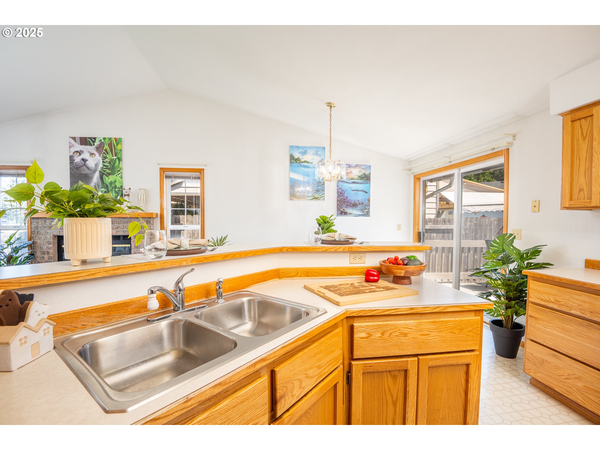 5669 D Street Springfield, OR 97478 - Photo 12 of 30 a kitchen with stainless steel appliances granite countertop a sink and a refrigerator