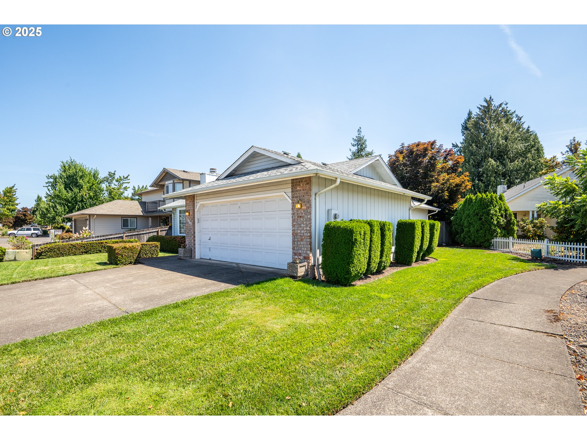 5669 D Street Springfield, OR 97478 - Photo 2 of 30 a view of a house with a yard and garage