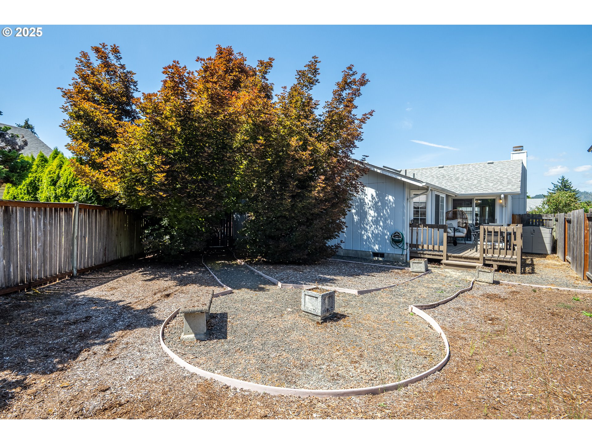 5669 D Street Springfield, OR 97478 - Photo 26 of 30 a backyard of a house with barbeque oven table and chairs