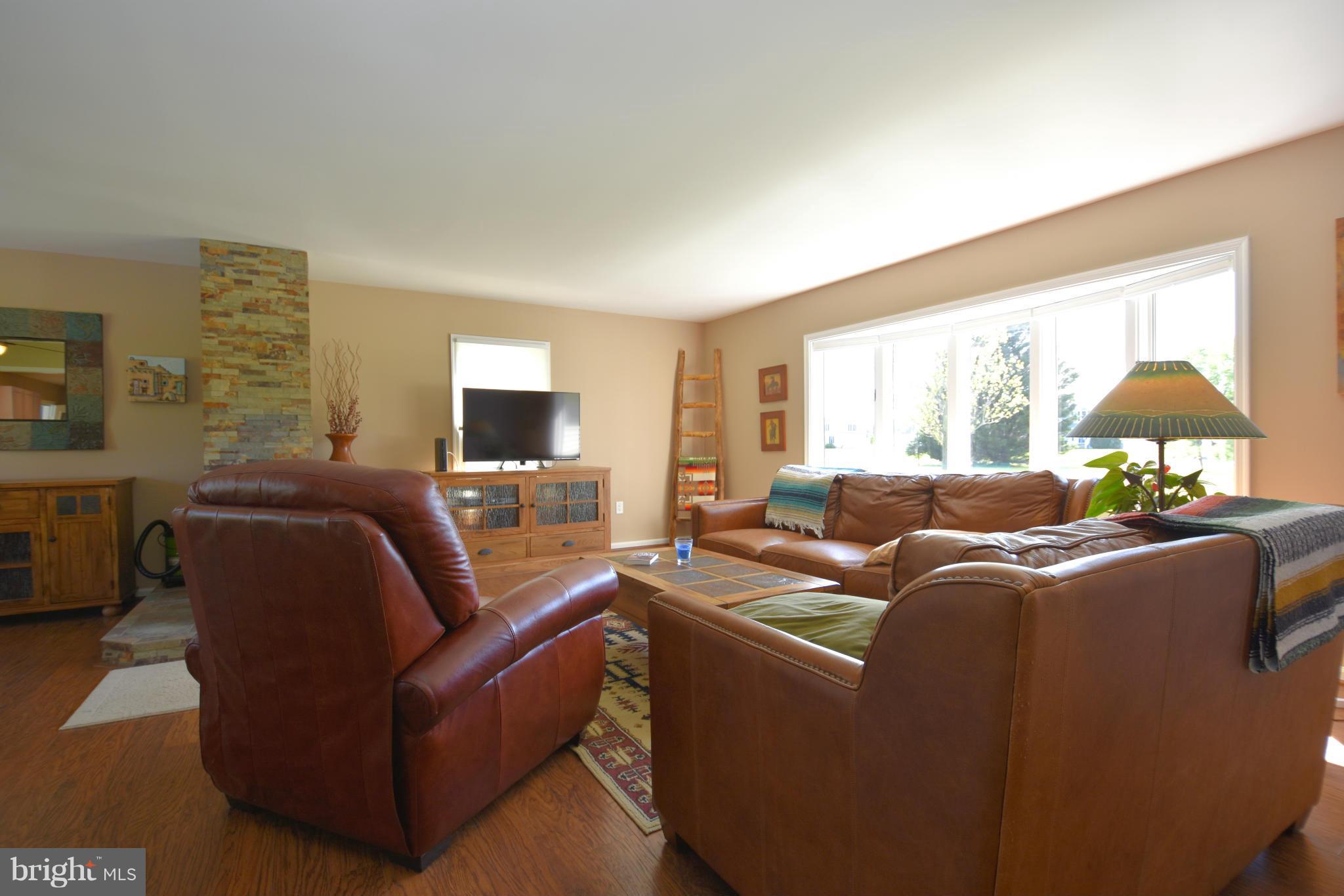 6677 Reeses Pride Road Sherwood, MD 21665 - Photo 6 of 30 Living Room with Pellet Stove