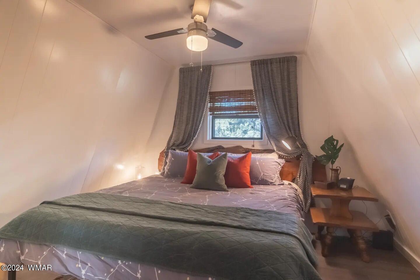3550 North Buckskin Road Overgaard, AZ 85933 - Photo 20 of 30 a bedroom with a bed and a window