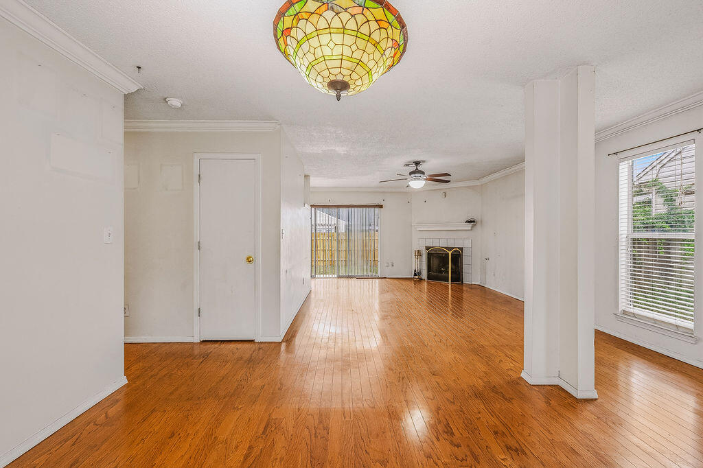 53 4th Street Shalimar, FL 32579 - Photo 9 of 47 an empty room with wooden floor and windows