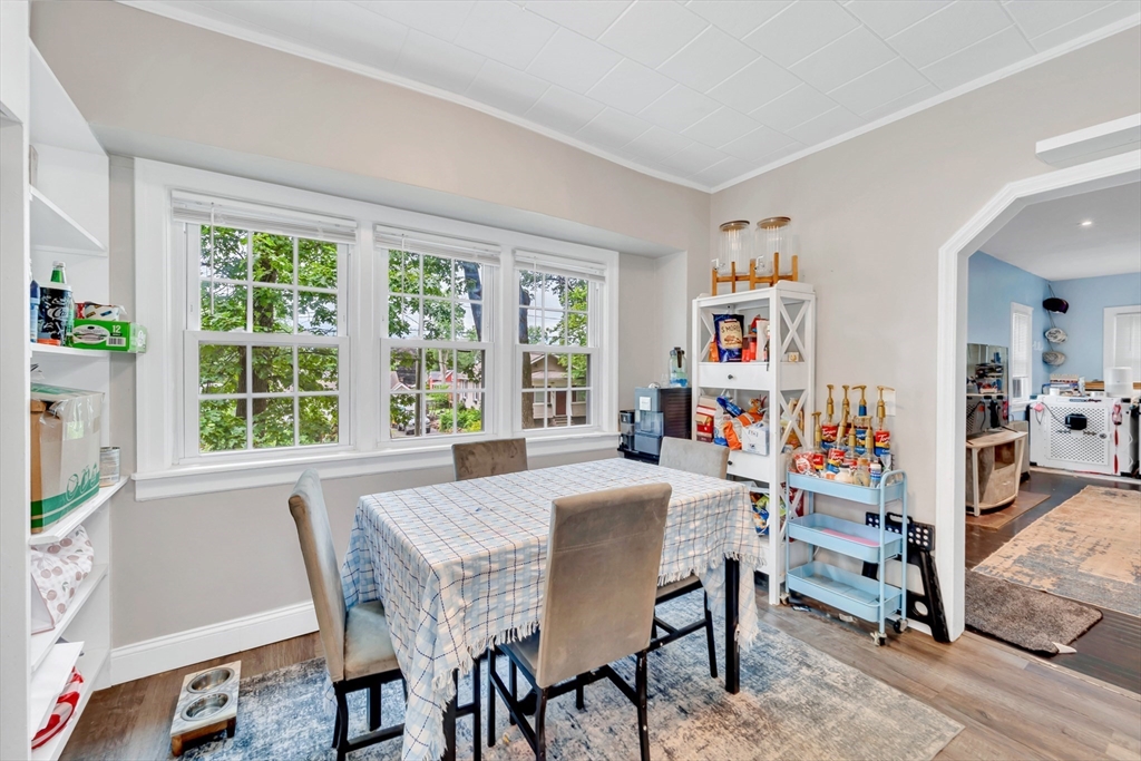 295 Harkness Avenue Springfield, MA 01118 - Photo 11 of 39 a view of a dining room with furniture and a window