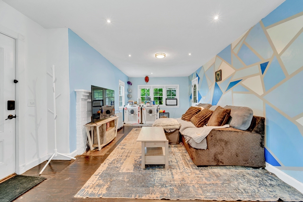 295 Harkness Avenue Springfield, MA 01118 - Photo 16 of 39 a living room with furniture and a flat screen tv